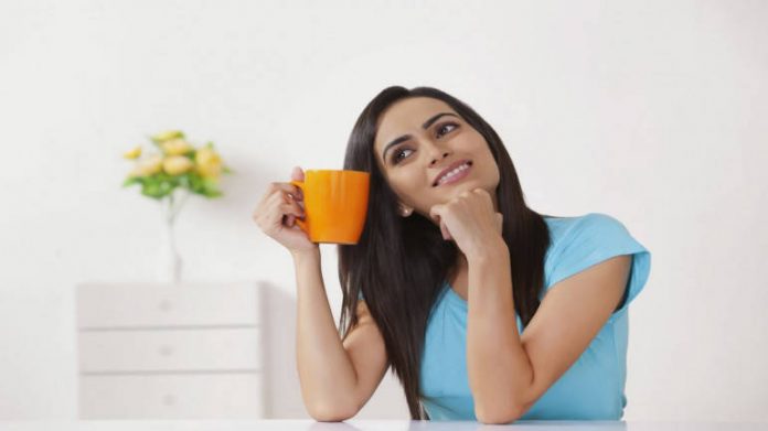 young-woman-thinking-travel-spending-planning-770x433