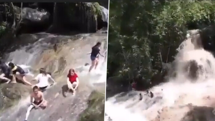 Old video shows tourists being washed away by flash floods at a waterfall in the Philippines