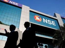 Market Milestone: NSE Files DRHP for Historic ₹30,000-Crore IPO to Become India’s Largest Public Issue A clean corporate trading desk overlooking a digital floor graph showing high-volume stock listings, designed with structured all-white geometry.